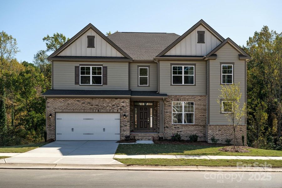 Front exterior of a new home in Oakridge Farms, Mooresville, NC, highlighting curb appeal (Image 1). Front exterior of a new home in Oakridge Farms, Mooresville, NC, highlighting curb appeal (Image 1).