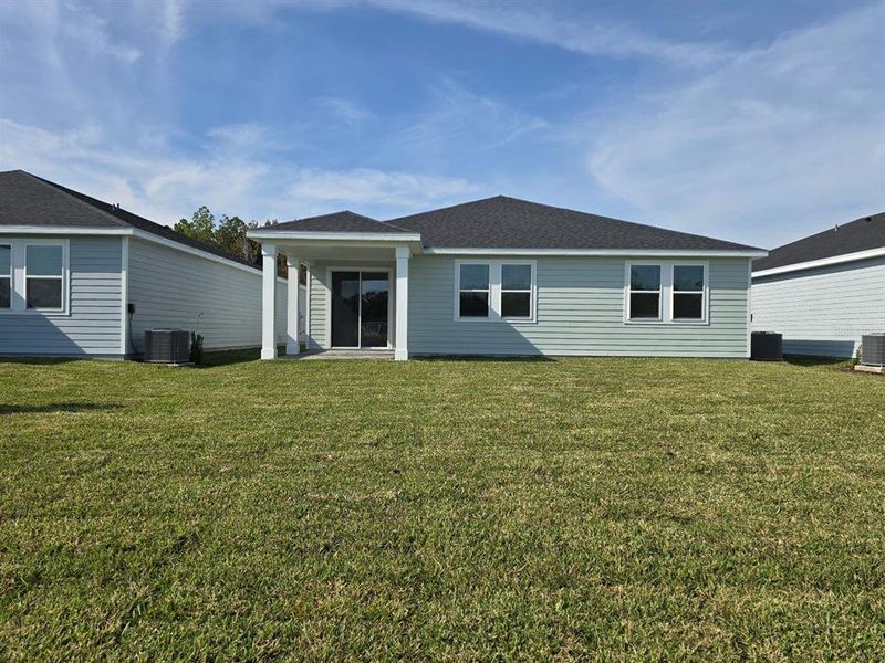 Exterior details and patio area of a home in Colbert Landings, Palm Coast (Image 3).