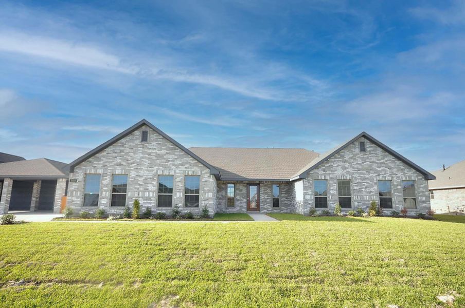 Front exterior of a new home in Pedregal, League City, TX, highlighting curb appeal (Image 23).