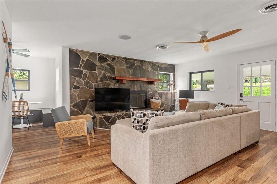 NEW luxury vinyl plank flooring, fresh interior paint, new Anderson windows and fixtures. Original fireplace!