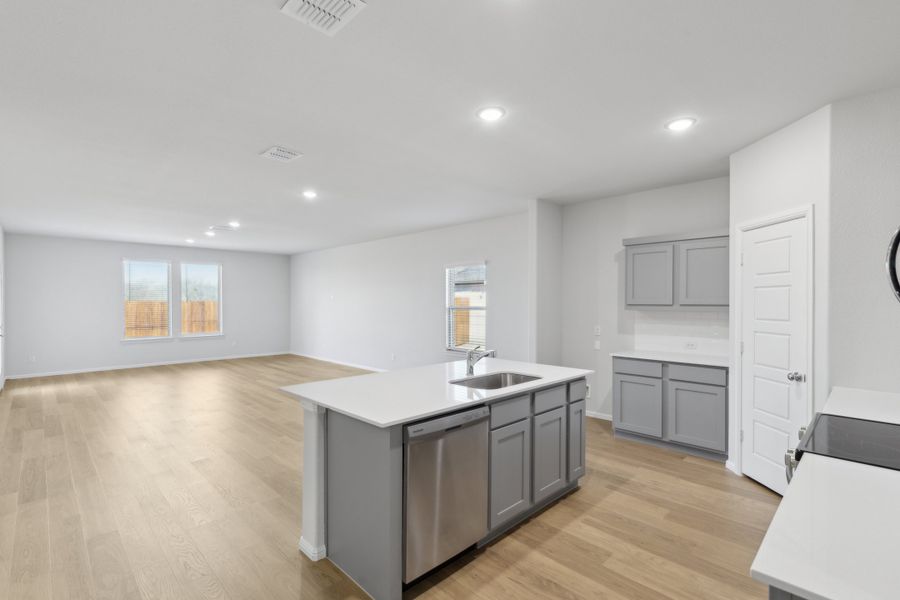 Kitchen in the Holden home plan by Trophy Signature Homes – REPRESENTATIVE PHOTO