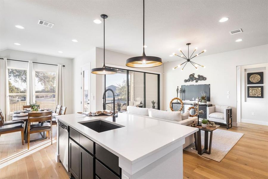 Enjoy this eat-in kitchen layout with stunning built-in stainless appliances and single basin sink with upgraded fixture.