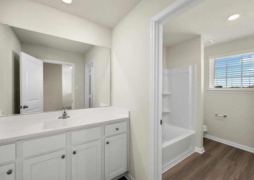 The secondary bathroom has a tub/shower combo.