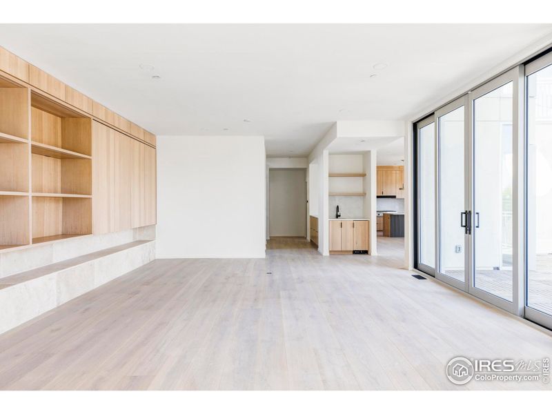 Inside, wide-plank white oak floors, tall ceilings, massive anodized aluminum windows and a neutral color palette emphasize glorious natural light and wide-open outlooks.