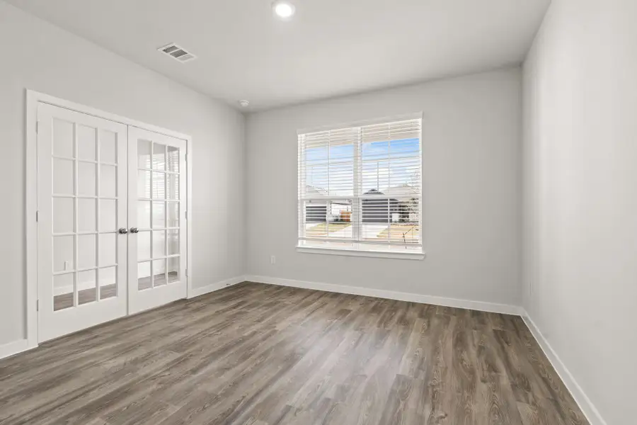 Spacious, unfurnished interior of a new home in Liberty Collection at Paloma at Sanford Farms, Waller (Image 15).