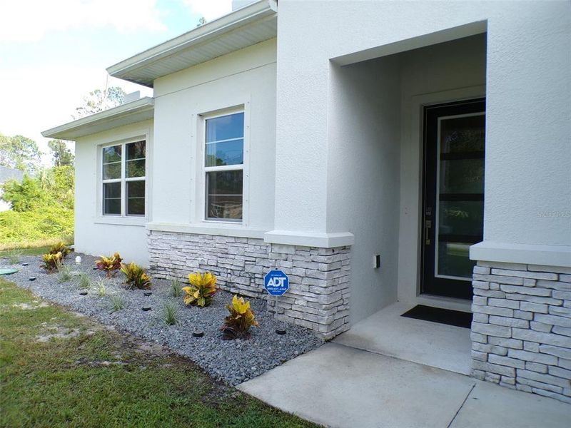 Exterior details and patio area of a home in , North Port (Image 26).