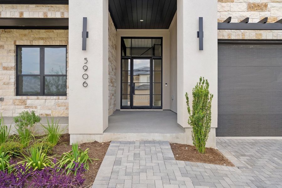 Front exterior of a new home in Milky Way at River Place, Austin, TX, highlighting curb appeal (Image 2).