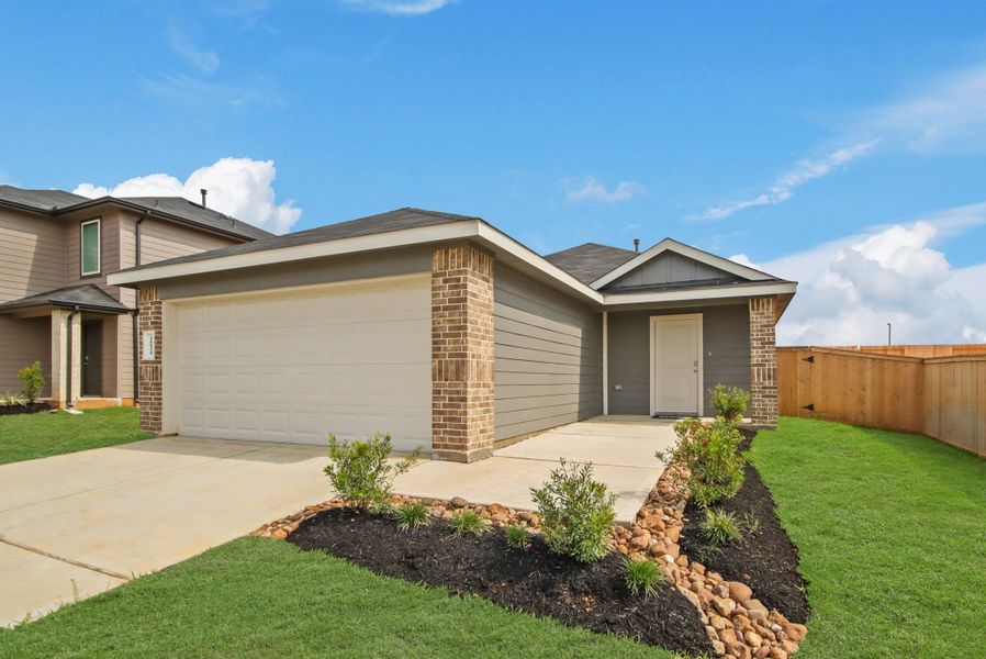 Front exterior of a new home in Mill Creek, Magnolia, TX, highlighting curb appeal (Image 1). Front exterior of a new home in Mill Creek, Magnolia, TX, highlighting curb appeal (Image 1).