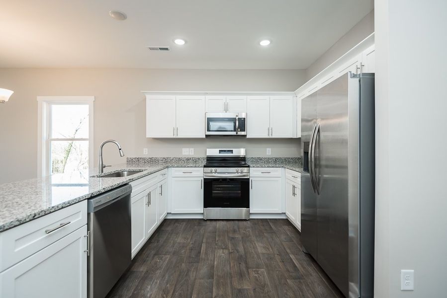 Representative furnished interior of a home built from the TH 1425 END by Foundation Home Builders LLC in Stokesburg Road Townhomes, Walnut Cove (Image 5).