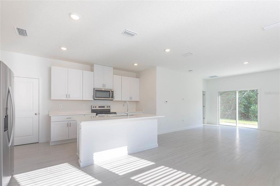 Furnished interior view inside a new home in Flagler Village - Classic Series, Palm Coast (Image 11).