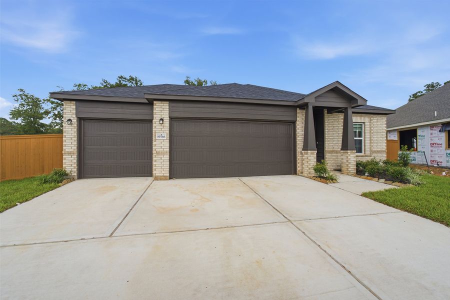 Front exterior of a new home in Cypress Green, Hockley, TX, highlighting curb appeal (Image 17). Front exterior of a new home in Cypress Green, Hockley, TX, highlighting curb appeal (Image 17).