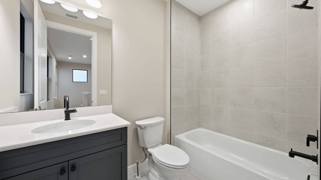 Furnished interior view inside a new home in PGA Village Verano, Port St. Lucie (Image 17).
