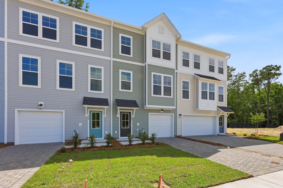 Front exterior of a new home in Rhetts Cove, Johns Island, SC, highlighting curb appeal (Image 22). Front exterior of a new home in Rhetts Cove, Johns Island, SC, highlighting curb appeal (Image 22).