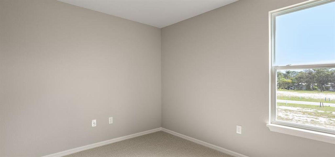 Spacious, unfurnished interior of a new home in Harbor at Lake Henry - Townhomes, Winter Haven (Image 13).