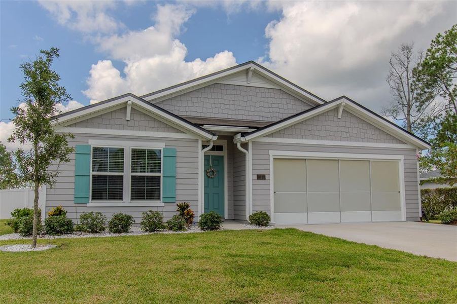 Front exterior of a new home in Palm Coast Homesites, Palm Coast, FL, highlighting curb appeal (Image 20).