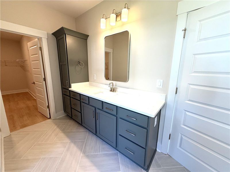 This bathroom features a sleek vanity and a spacio
