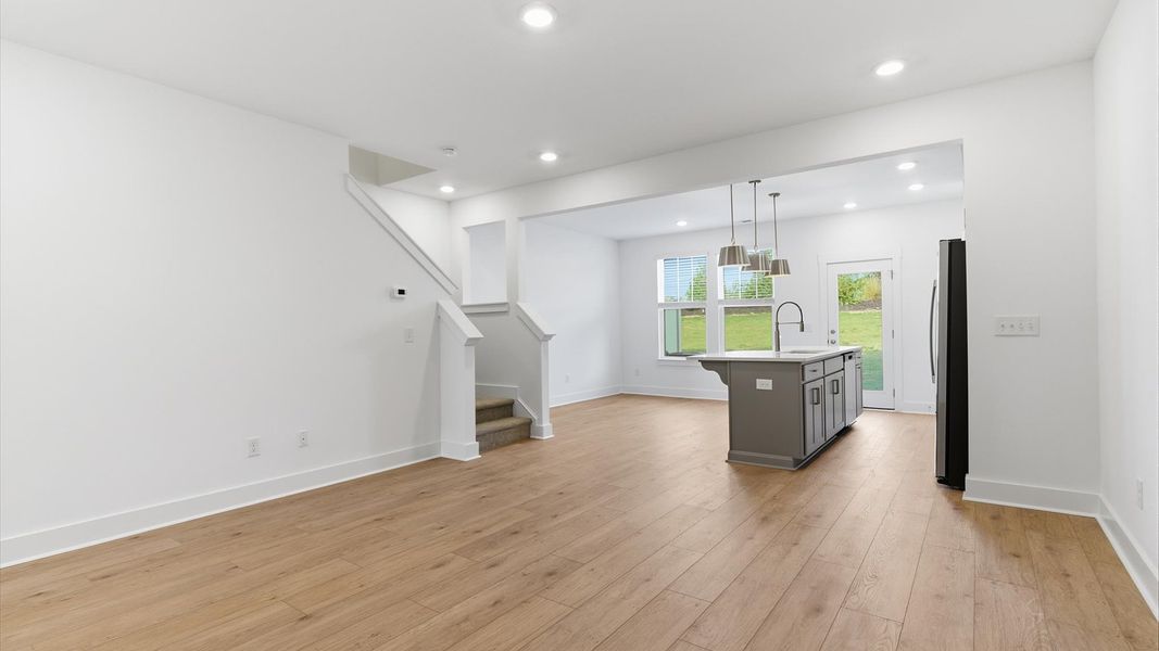 Memorable moments begin in this elegant, open family room with hardwood flooring and refined finishes at Silo Ridge