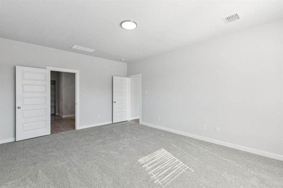 Primary Suite in the Winters home plan by Trophy Signature Homes – REPRESENTATIVE PHOTO