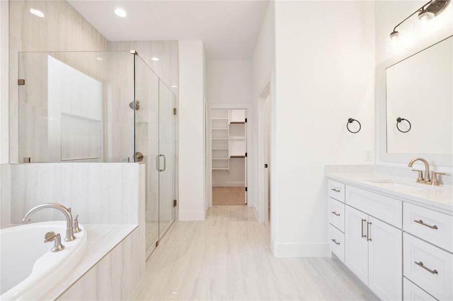 Bathroom with vanity and independent shower and bath