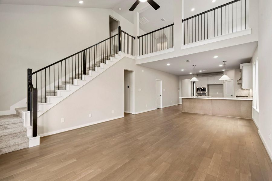 Huge family room with a winding staircase off to the side that leads to an oversize upstairs gameroom! Huge family room with a winding staircase off to the side that leads to an oversize upstairs gameroom!