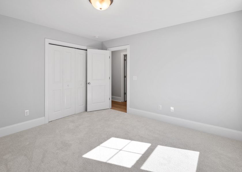 Spacious, unfurnished interior of a new home in Osprey Landing, Southport (Image 33).