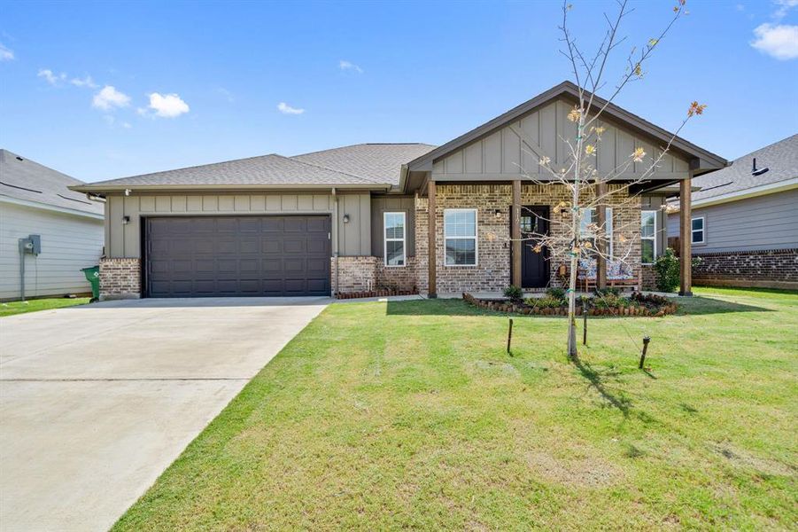 Front exterior of a home in the Magnolia Estates community, located in Crowley, TX (Image 4).