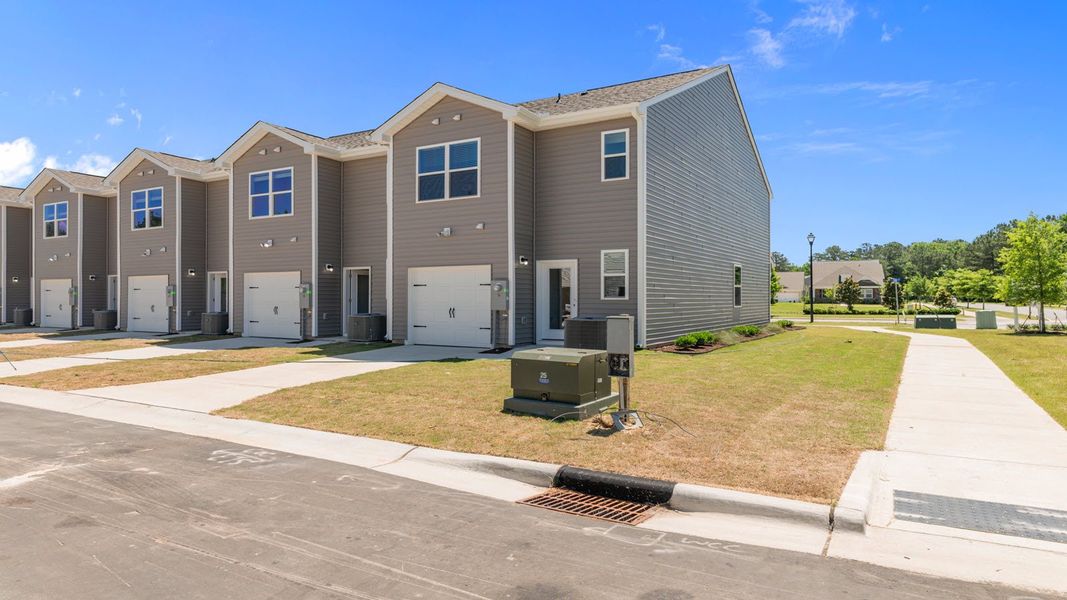 Representative exterior photo of a completed home built from the PEARSON II by D.R. Horton in Clock Road Townhomes, New Bern, NC (Image 19). Representative exterior photo of a completed home built from the PEARSON II by D.R. Horton in Clock Road Townhomes, New Bern, NC (Image 19).