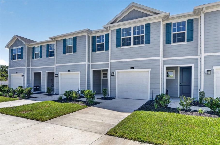 Front exterior of a new home in , Palm Coast, FL, highlighting curb appeal (Image 23).