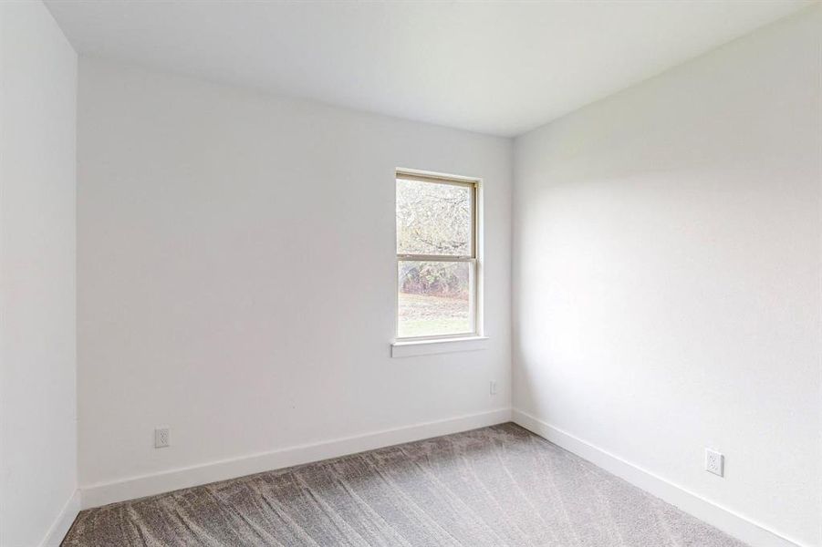 View of carpeted spare room