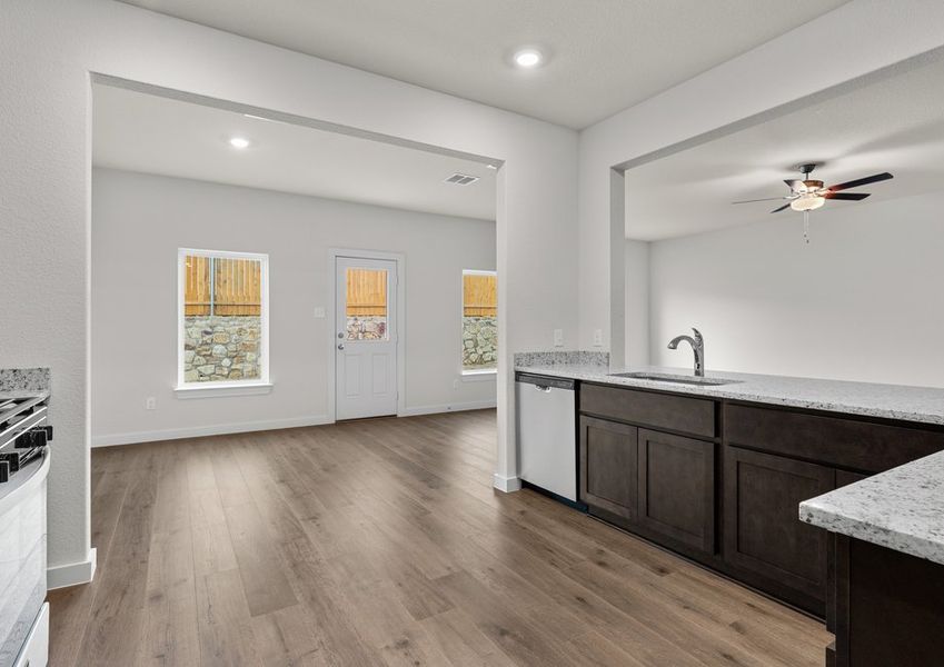 The dining room sits right off of the kitchen. The dining room sits right off of the kitchen.