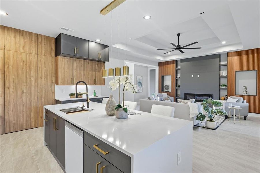 Kitchen with wood walls, hanging light fixtures, modern cabinets, gray cabinetry, and light stone counters Kitchen with wood walls, hanging light fixtures, modern cabinets, gray cabinetry, and light stone counters