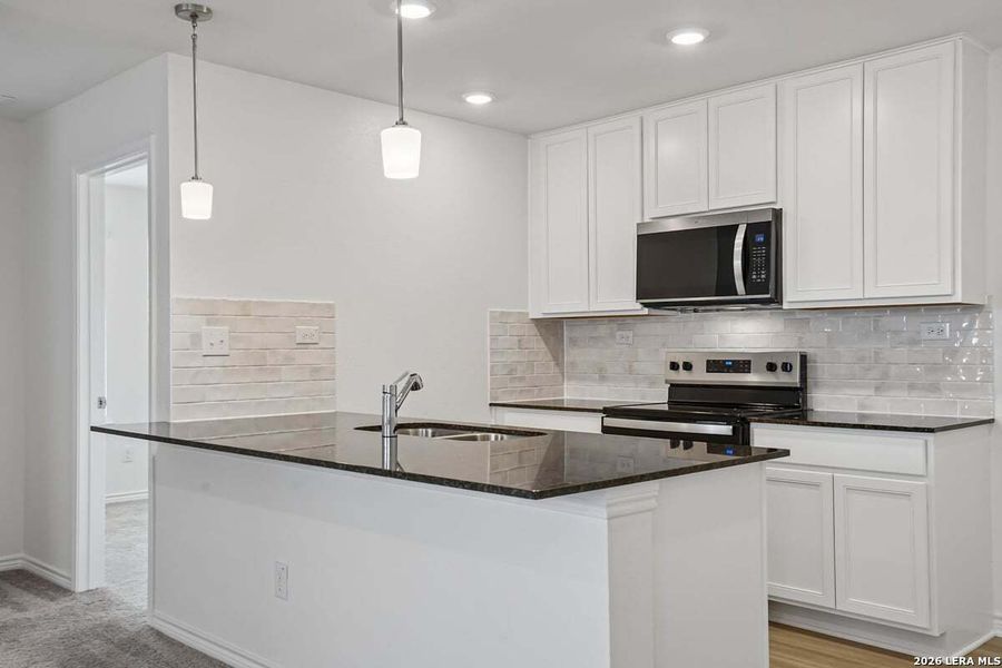 Furnished interior view inside a new home in Southton Cove, Elmendorf (Image 4).