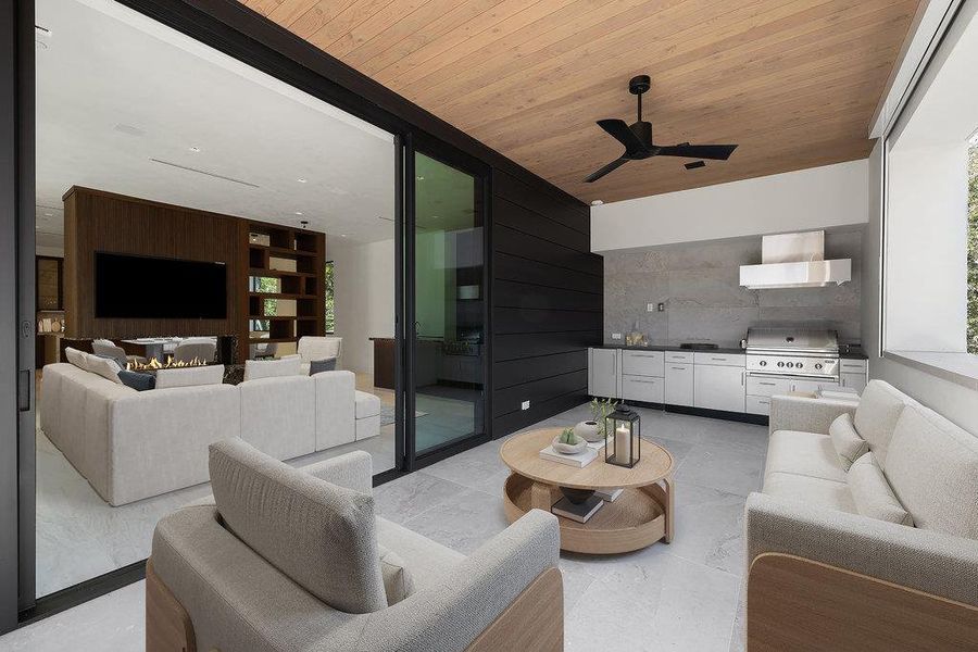Living room with wooden ceiling and a ceiling fan