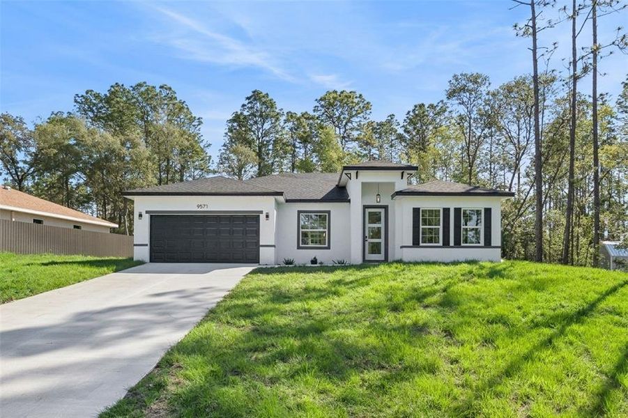 Front exterior of a new home in , Citrus Springs, FL, highlighting curb appeal (Image 1). Front exterior of a new home in , Citrus Springs, FL, highlighting curb appeal (Image 1).