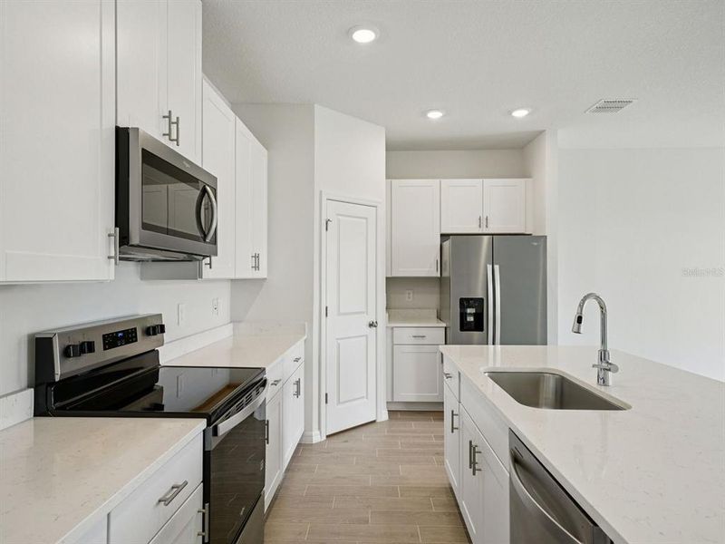 Furnished interior view inside a new home in Oakfield Trails - Classic Series, Parrish (Image 5). Furnished interior view inside a new home in Oakfield Trails - Classic Series, Parrish (Image 5).
