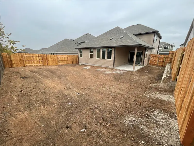 Exterior details and patio area of a home in Covered Bridge, Hutto (Image 3).
