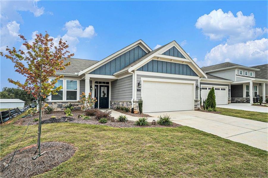 Front exterior of a new home in , Dallas, GA, highlighting curb appeal (Image 1).