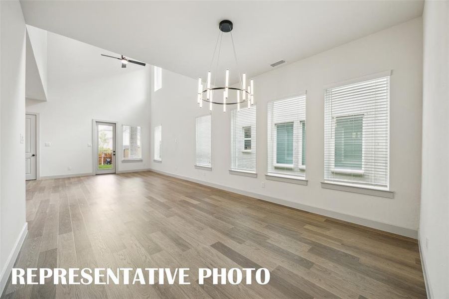 This light filled dining room featuring a wall of windows is the perfect place to host lively dinner parties or cozy family meals.  REPRESENTATIVE PHOTO