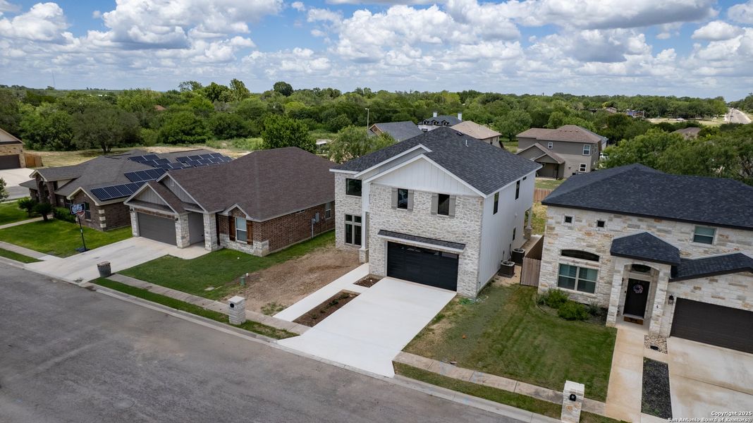 Front exterior of a new home in , Uvalde, TX, highlighting curb appeal (Image 1).