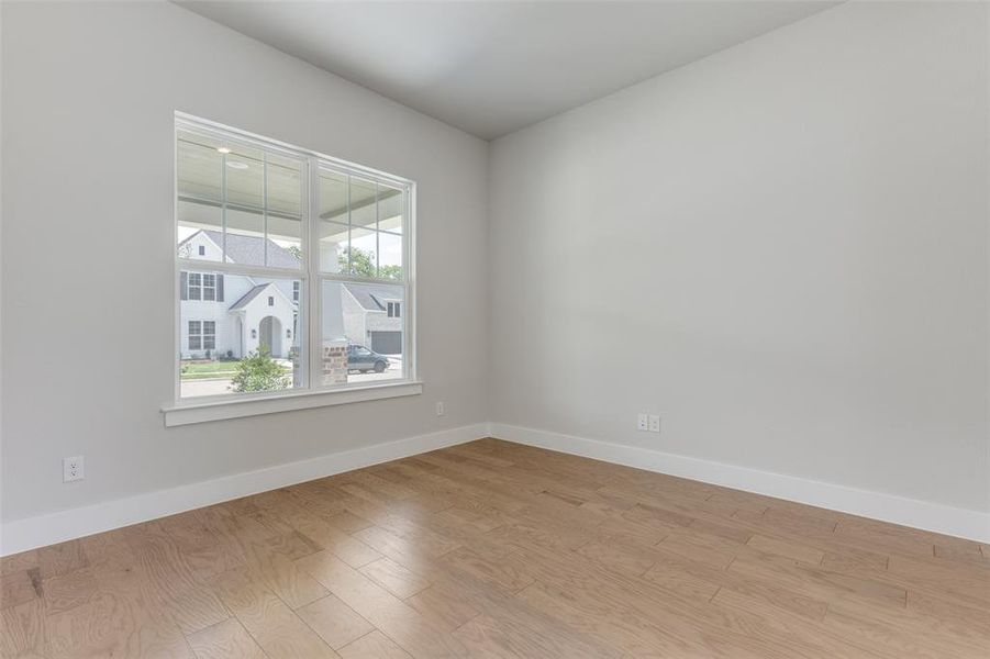 Spare room with light hardwood / wood-style flooring