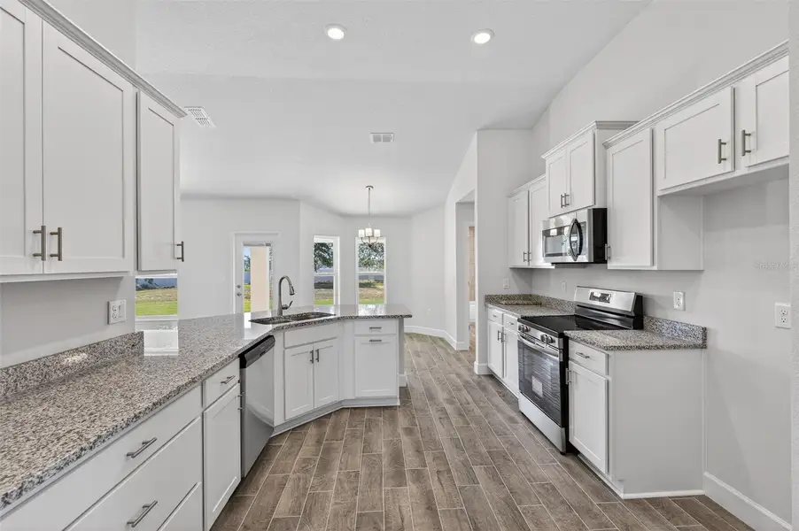 Furnished interior view inside a new home in Hill Country Estates, Dade City (Image 8).