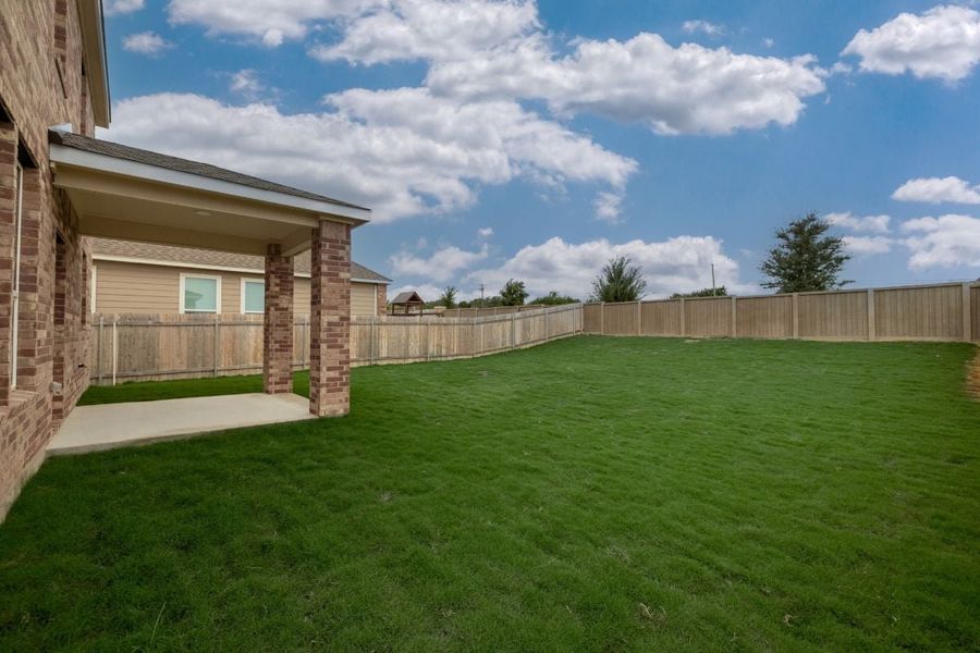 Exterior details and patio area of a home in Overlook Ranch, Georgetown (Image 21).