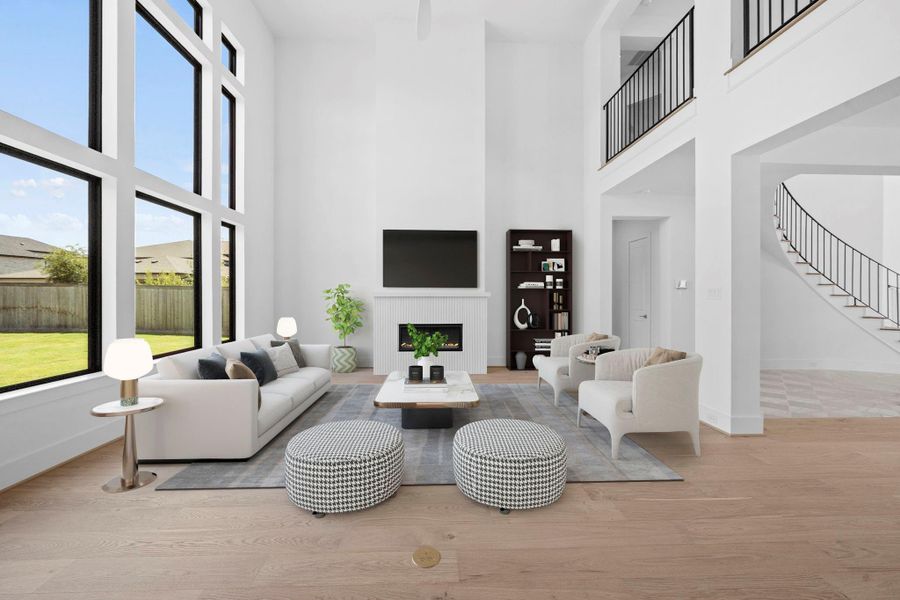 *Virtual Staging* Dramatic living area with soaring ceilings, expansive windows, and abundant natural light.