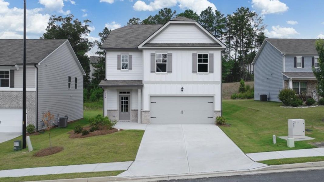 Front exterior of a new home in Lost Creek, Dallas, GA, highlighting curb appeal (Image 1). Front exterior of a new home in Lost Creek, Dallas, GA, highlighting curb appeal (Image 1).