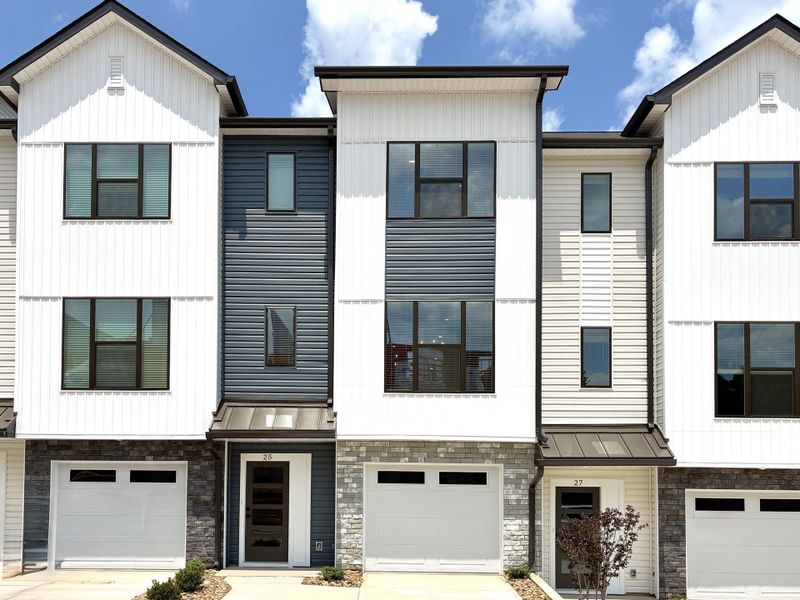 Front exterior of a new home in Holly View, Greenville, SC, highlighting curb appeal (Image 1). Front exterior of a new home in Holly View, Greenville, SC, highlighting curb appeal (Image 1).