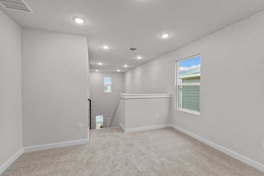 A room with a white wall and a window. A room with a white wall and a window.