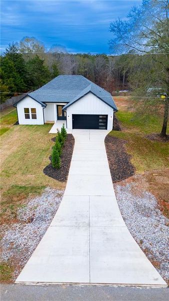 Front exterior of a new home in , Monroe, GA, highlighting curb appeal (Image 17).