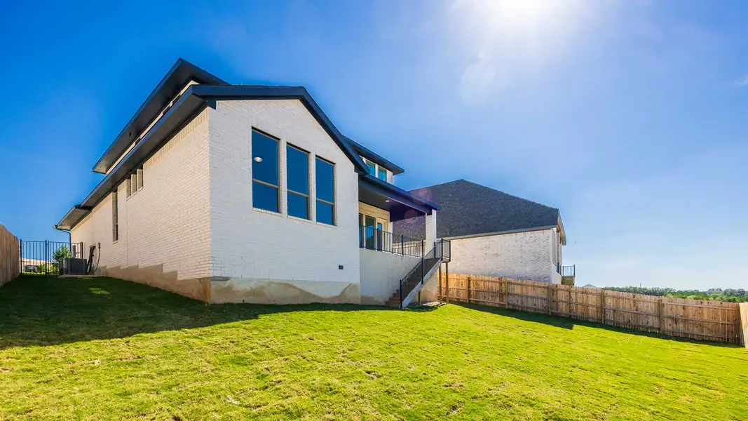 Exterior details and patio area of a home in Eldorado At Santa Rita Ranch 50', Liberty Hill (Image 3).