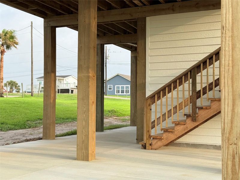 Stairs to covered area under house. Stairs to covered area under house.