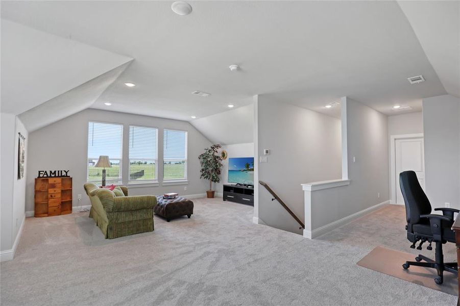 Home office with carpet, lofted ceiling, baseboards, and recessed lighting Home office with carpet, lofted ceiling, baseboards, and recessed lighting